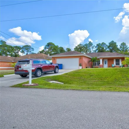Buy this 3 bed house on 2611 7th Street Southwest in Lehigh Acres, FL 33976