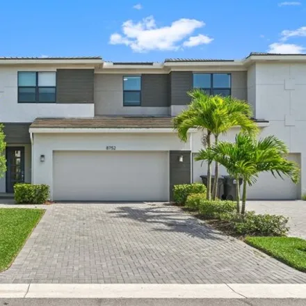 Buy this 4 bed townhouse on 8752 Corvus Dr in Lake Worth, Florida