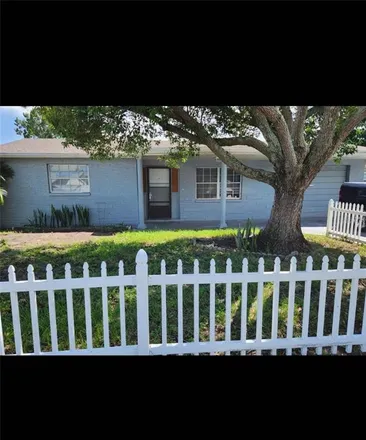 Rent this 4 bed house on 3136 Primrose Drive in Holiday, FL 34691