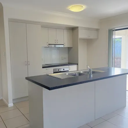 Rent this 4 bed apartment on 94A Daintree Drive in Bushland Beach QLD 4818, Australia