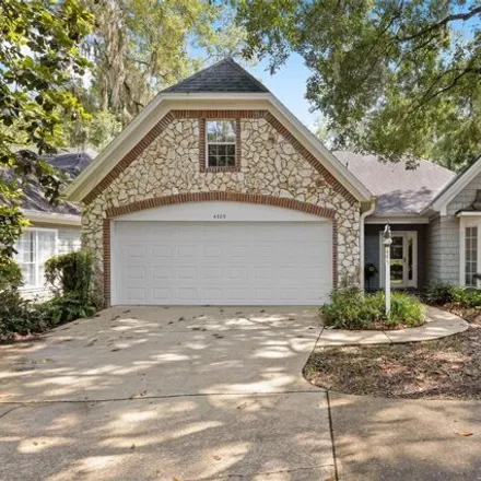 Buy this 3 bed house on Northwest 10th Place in Gainesville, FL