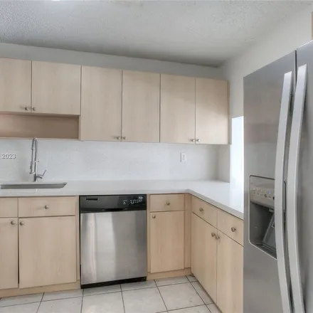 Rent this 2 bed apartment on 10090 Northwest 80th Court in Hialeah Gardens, FL 33016