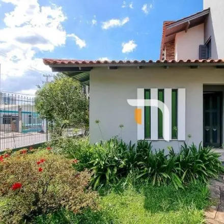 Rent this 3 bed house on Rua Pompílio Gomes in Dom Feliciano, Gravataí - RS