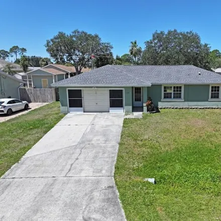 Rent this 3 bed house on 120 Bonfire Avenue Northeast in Palm Bay, FL 32907