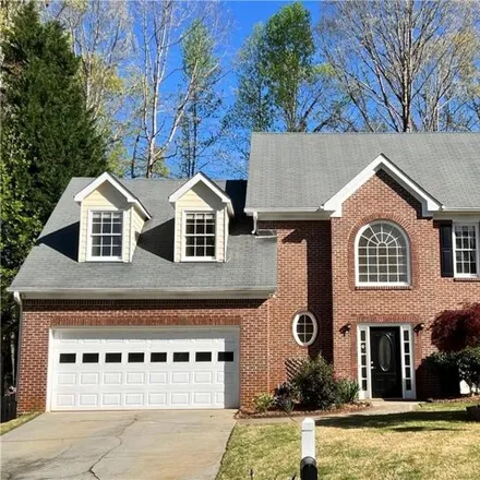 Buy this 4 bed house on 1633 Watercove Lane in Gwinnett County, GA 30043