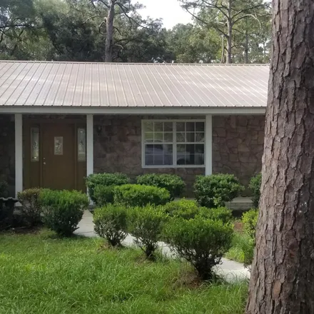 Rent this 4 bed house on 593 East Ash Street in Perry, FL 32347