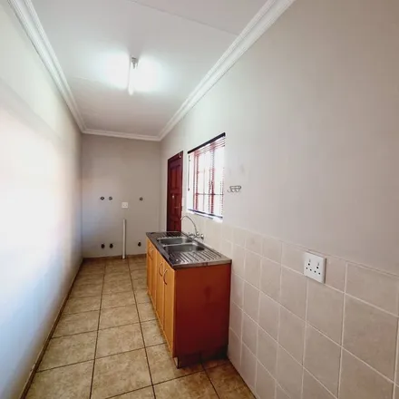 Rent this 3 bed townhouse on Flamwood Drive in Adamayview, Klerksdorp
