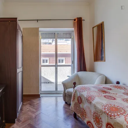 Rent this 6 bed room on Rua de Arroios 58 in 1150-056 Lisbon, Portugal