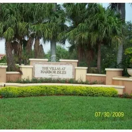 Rent this 3 bed townhouse on 4967 Tradewinds Terrace in Avon Park, Dania Beach