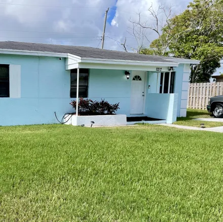 Buy this 3 bed house on 1217 15th Avenue South in Lake Worth Beach, FL 33460
