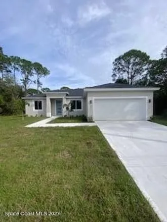Buy this 4 bed house on 1501 Tharp Road Southeast in Palm Bay, FL 32909
