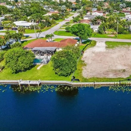 Buy this 4 bed house on 8191 Pine Tree Lane in Lake Clarke Shores, Palm Beach County