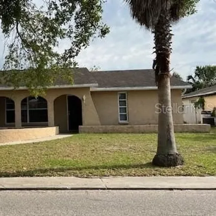 Rent this 4 bed house on 6948 Sandalwood Drive in Jasmine Estates, FL 34668