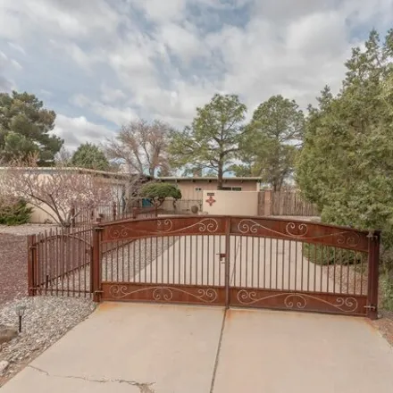 Buy this 3 bed house on Desert Greens Golf Course in 10035 Country Club Lane Northwest, Albuquerque
