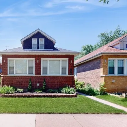 Buy this 4 bed house on 8004 South Woodlawn Avenue in Chicago, IL 60619