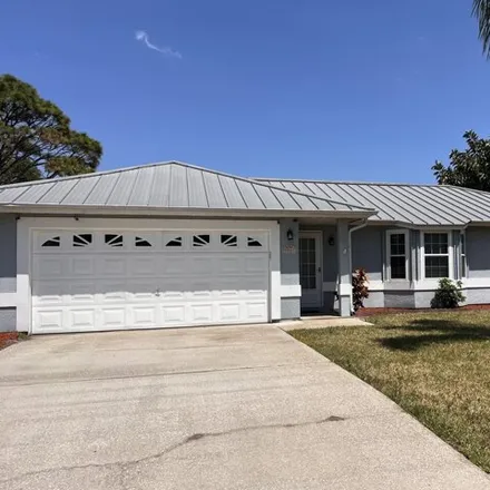 Rent this 4 bed house on 5989 Cardiff Avenue in Brevard County, FL 32927