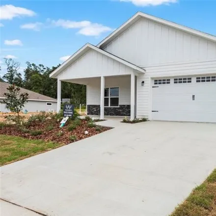 Buy this 4 bed house on 6624 Sw 10th Ln in Gainesville, Florida