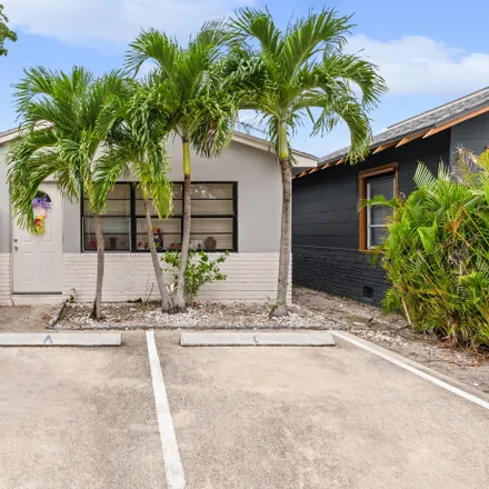 Rent this 2 bed townhouse on tiny free library Charter #28364 in 432 South J Street, Lake Worth Beach