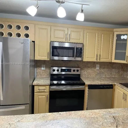 Rent this 3 bed townhouse on 7542 Northwest 175th Street in Palm Springs North, Hialeah