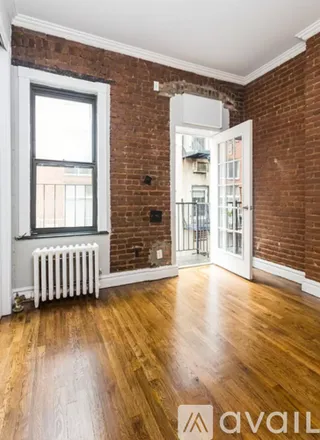 Rent this 2 bed duplex on 219 E 23rd St