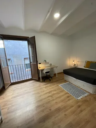 Rent this 3 bed room on Carrer Nou de la Rambla in 106, 08001 Barcelona