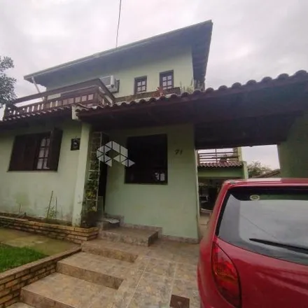 Buy this 4 bed house on Rua Américo Vespúcio in Nossa Senhora das Graças, Canoas - RS
