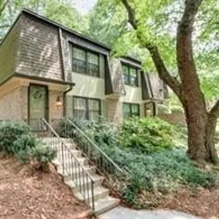 Rent this 2 bed townhouse on 75 Monet Court Northwest in Atlanta, GA 30327