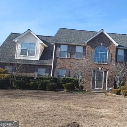 Buy this 4 bed house on 3522 Spuring Mesa Drive Southwest in Gwinnett County, GA 30039
