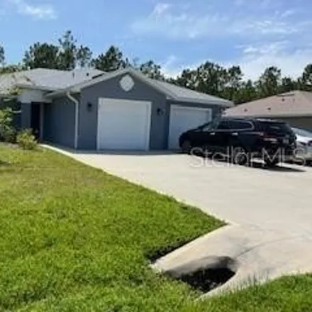 Rent this 3 bed house on 61 Freneau Lane in Palm Coast, FL 32137