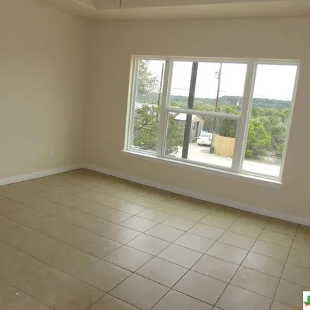 Rent this 3 bed apartment on 2476 Golf Drive in Comal County, TX 78070