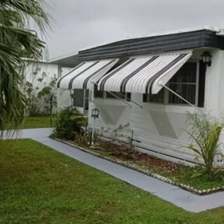 Buy this studio apartment on 93 Southeast Spanish Way in Saint Lucie County, FL 34952