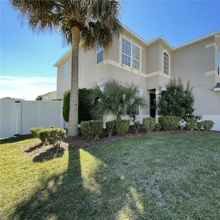Rent this 4 bed house on 14103 Abaco Isle Drive in Meadow Woods, Orange County