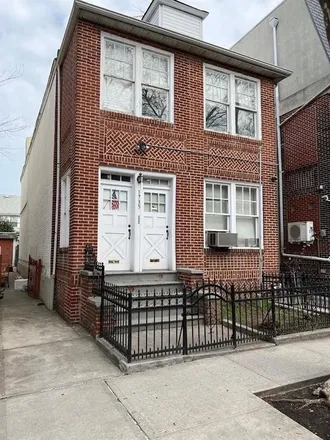 Buy this 7 bed townhouse on 1727 59th Street in New York, NY 11204