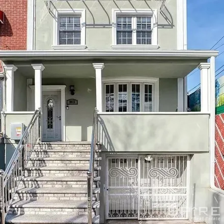 Buy this 5 bed house on 28-12 100th Street in New York, NY 11369