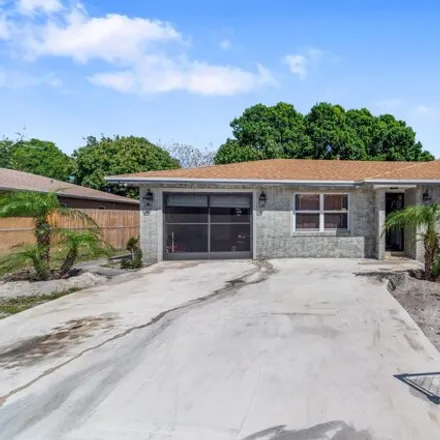 Buy this 3 bed house on 3050 Kingsley Drive in Harmony Heights, Saint Lucie County