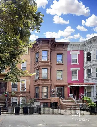 Buy this 6 bed townhouse on 958 Greene Avenue in New York, NY 11221