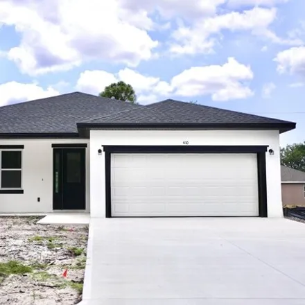 Buy this 4 bed house on 410 Flat River Street Southwest in Palm Bay, FL 32908