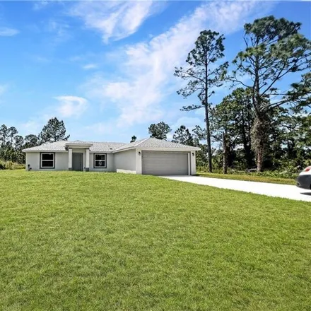 Rent this 3 bed house on 580 Genoa Ave S in Lehigh Acres, Florida