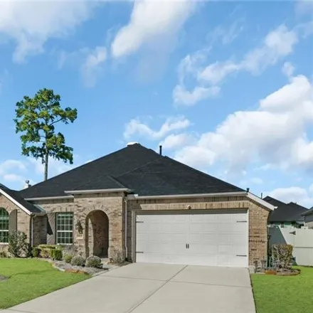 Rent this 4 bed house on 9937 Common Hawker Court in Montgomery County, TX 77385