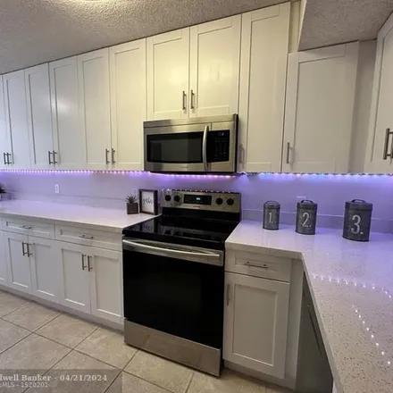 Rent this 3 bed apartment on 8849 Alpinia Drive in Coral Springs, FL 33067