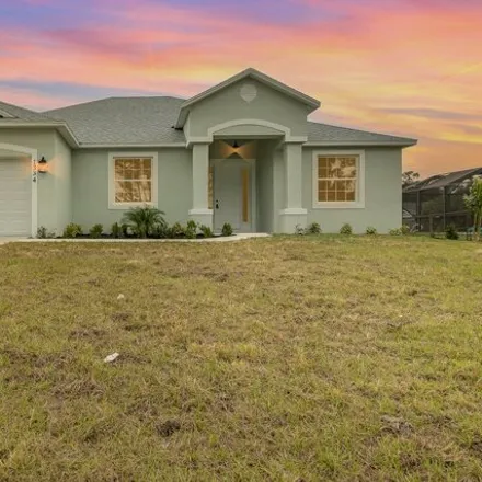 Buy this 4 bed house on 1340 Tordira Street Southeast in Palm Bay, FL 32909