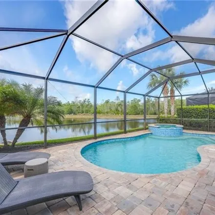 Buy this 4 bed house on 7420 Winding Cypress Dr in Naples, Florida