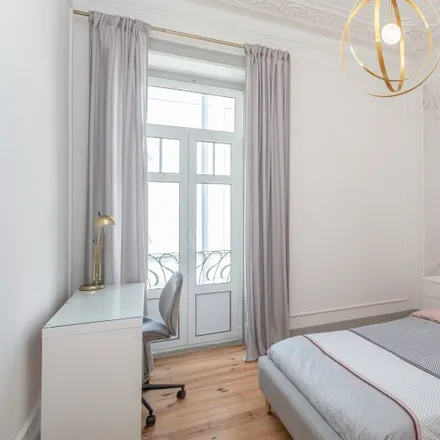 Rent this 6 bed room on Rua Tenente Ferreira Durão 7 in 1350-311 Lisbon, Portugal