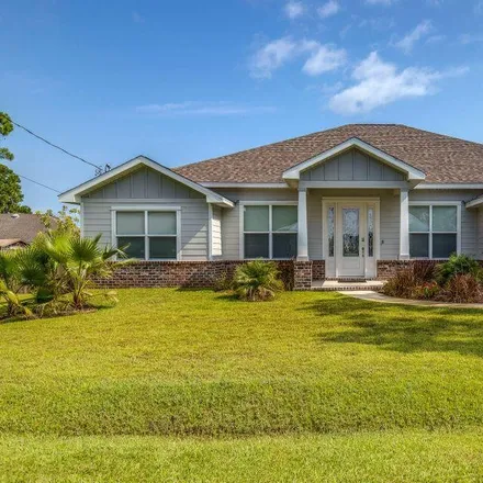 Rent this 4 bed house on 746 Forest Shore Drive in Miramar Beach, FL 32550