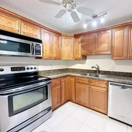 Rent this 2 bed condo on 5260 NW 2nd Ave