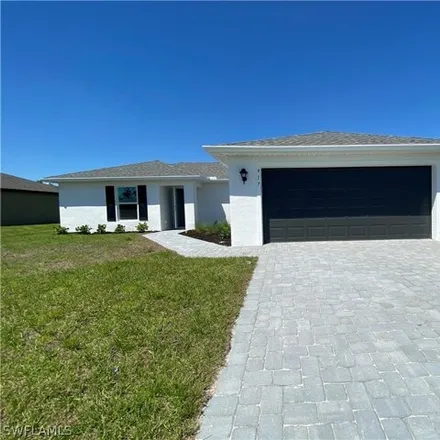 Rent this 3 bed house on 959 Northeast 32nd Street in Coral Lakes, Cape Coral