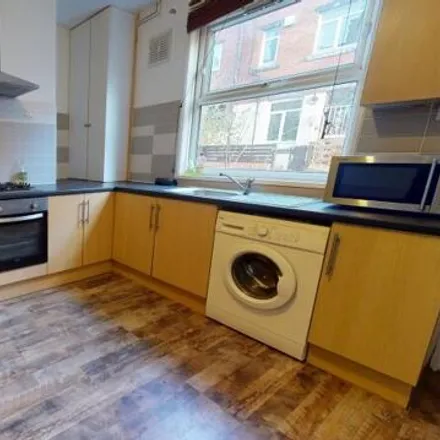 Rent this 4 bed townhouse on Spring Grove Walk in Leeds, LS6 1RR