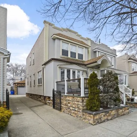 Buy this 3 bed house on 69-20 68th Street in New York, NY 11385