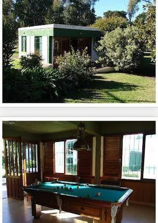Buy this 4 bed house on Bosque de Peralta Ramos in José Ignacio Thames, Alfar