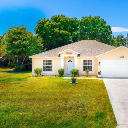 Buy this 3 bed house on 1236 Southwest Asturia Avenue in Port Saint Lucie, FL 34953